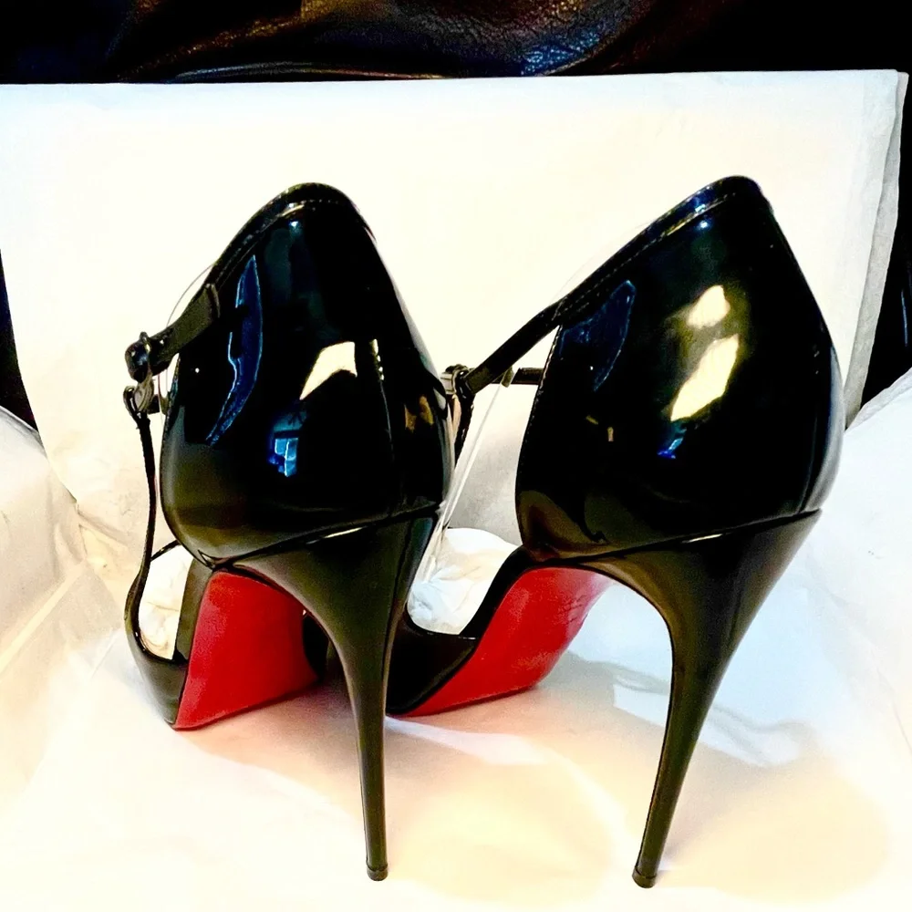 Christian Louboutin caged ankle strap peeptoe pumps. Glossy patent black 38.5